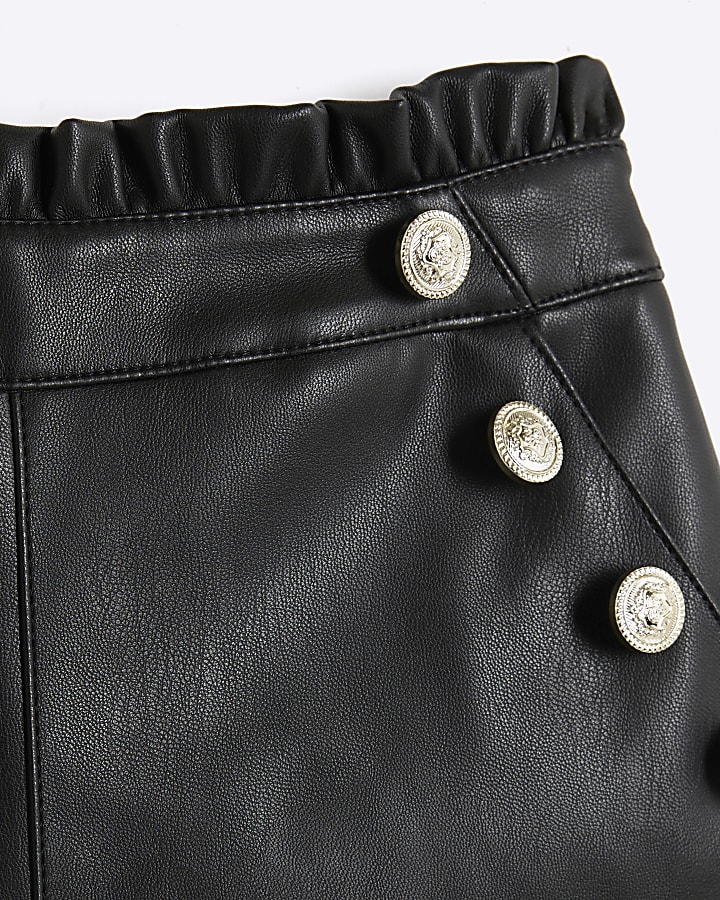 Girls black faux leather button shorts