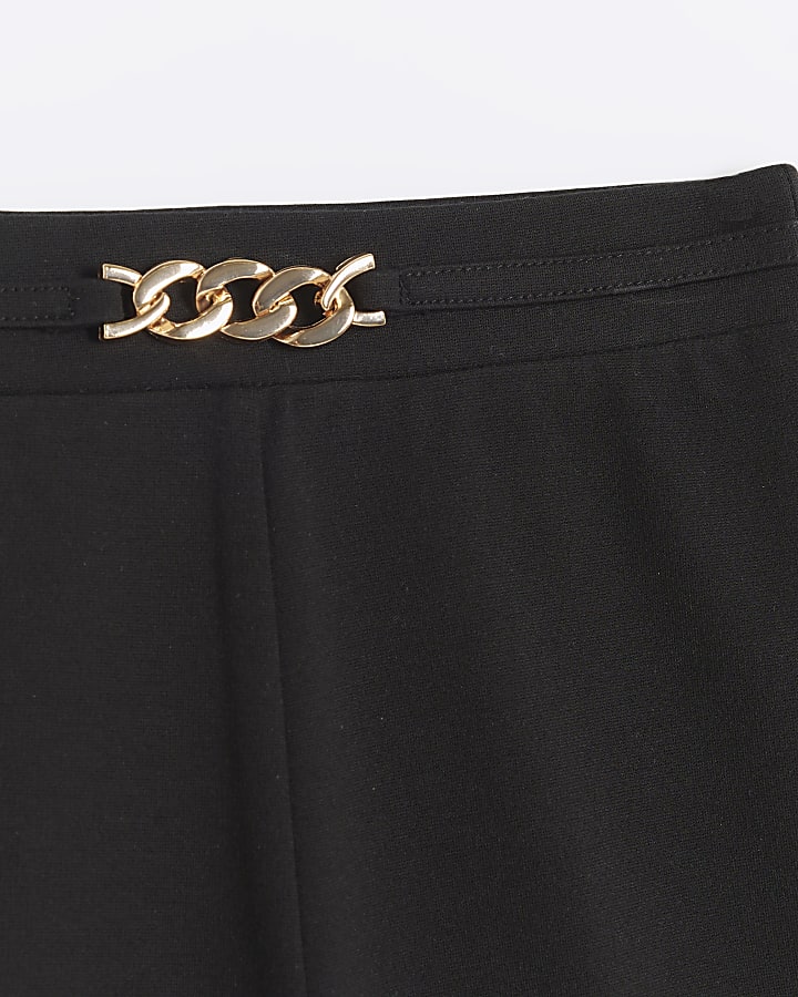 Girls black chain flared trousers