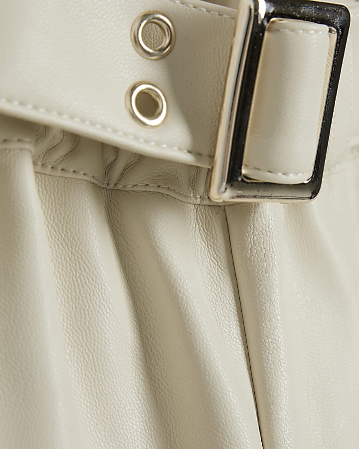 Girls cream faux leather belted shorts