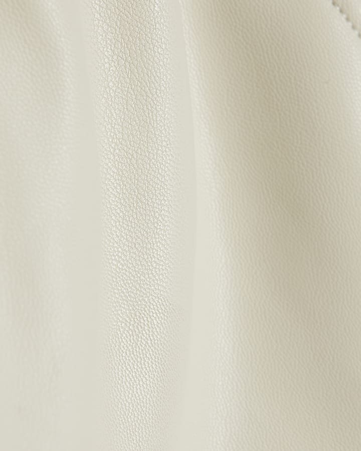 Girls cream faux leather belted shorts