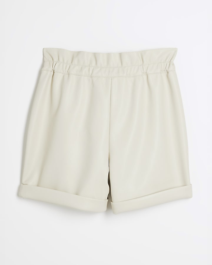 Girls cream faux leather belted shorts