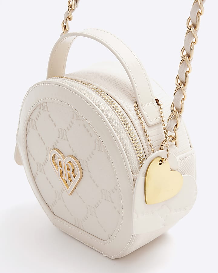 Girls cream embossed circle cross body bag