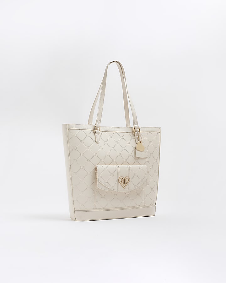 Girls cream embossed pocket shopper bag