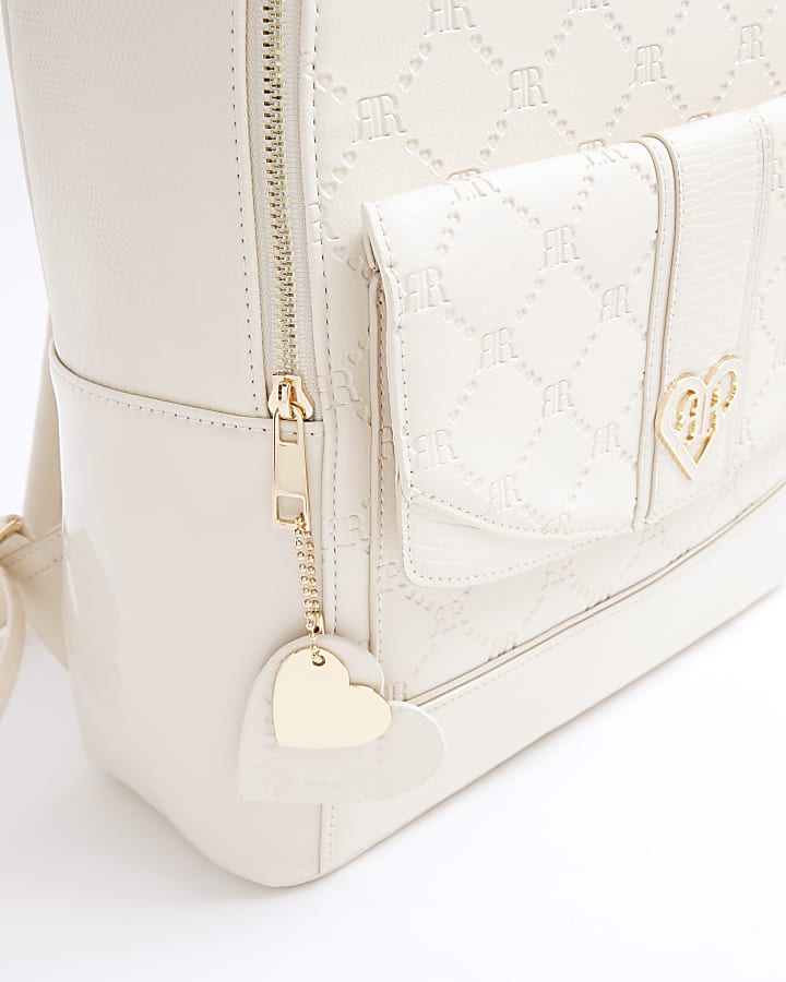 Girls cream embossed monogram backpack