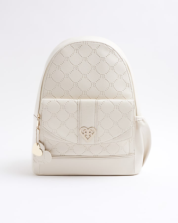 Girls cream embossed monogram backpack River Island