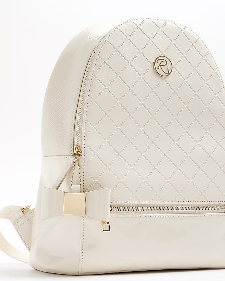 Girls cream bow quilted backpack set