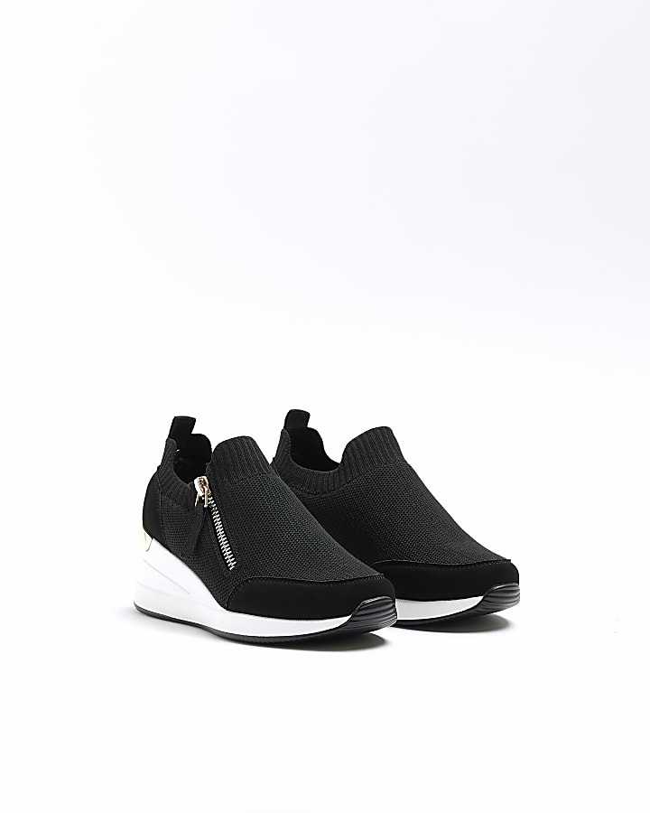 Girls black wedge trainers