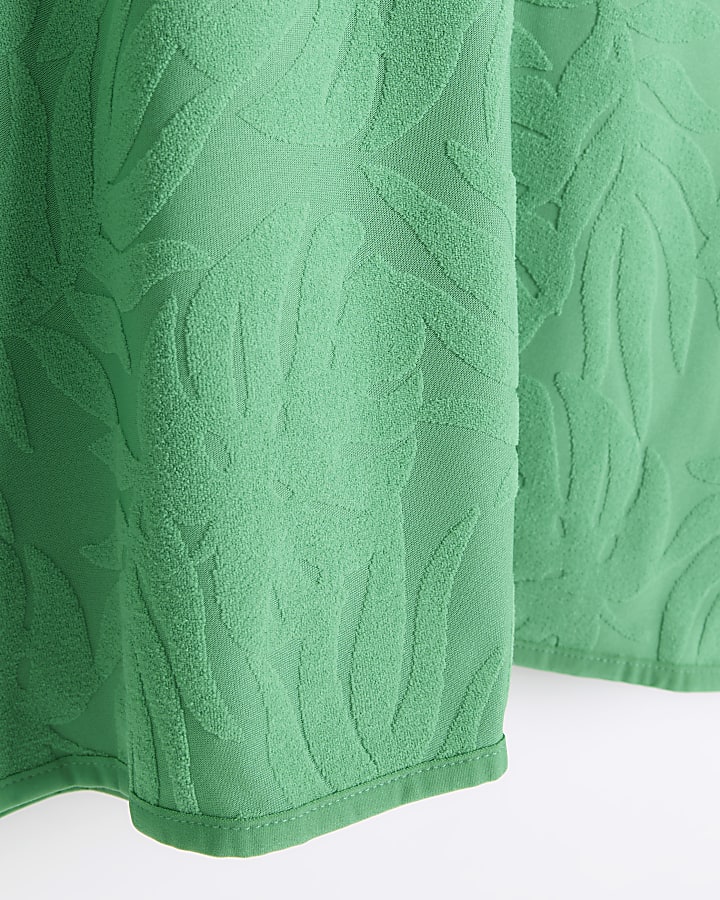 Boys green embossed towelling poncho