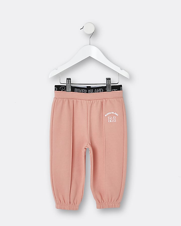 Mini girls orange RI waistband joggers River Island