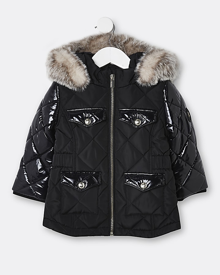 Mini girls black quilted puffer coats River Island