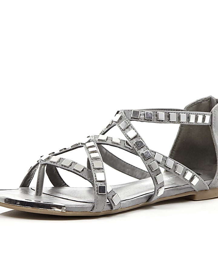 Grey studded metal gladiator sandals