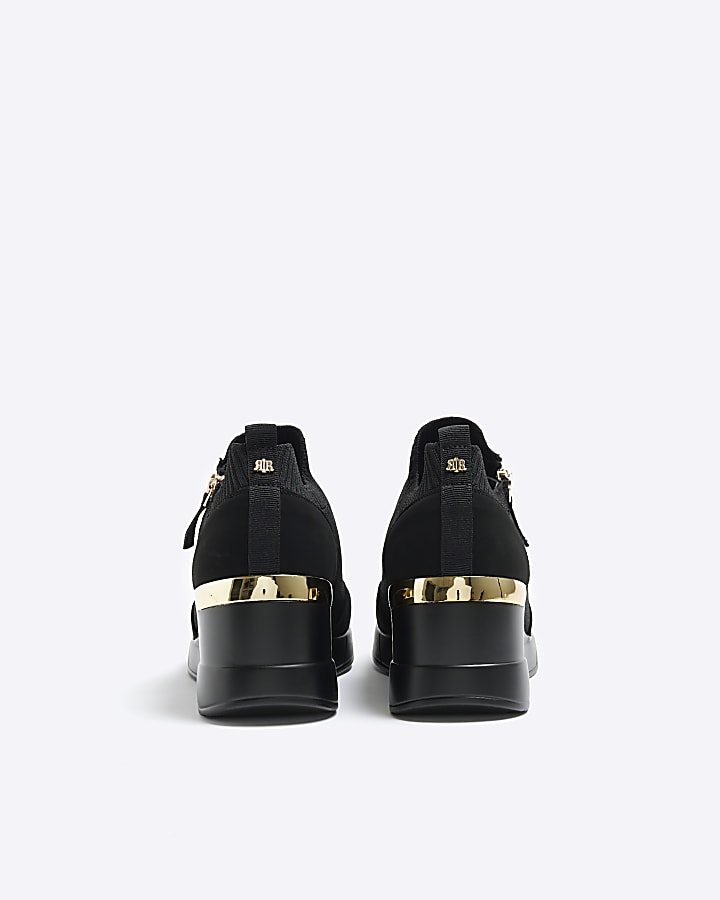 Black slip on wedge trainers