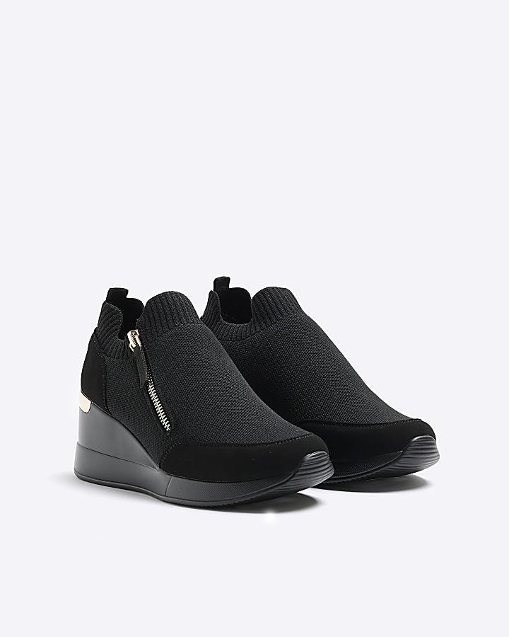 Black slip on wedge trainers