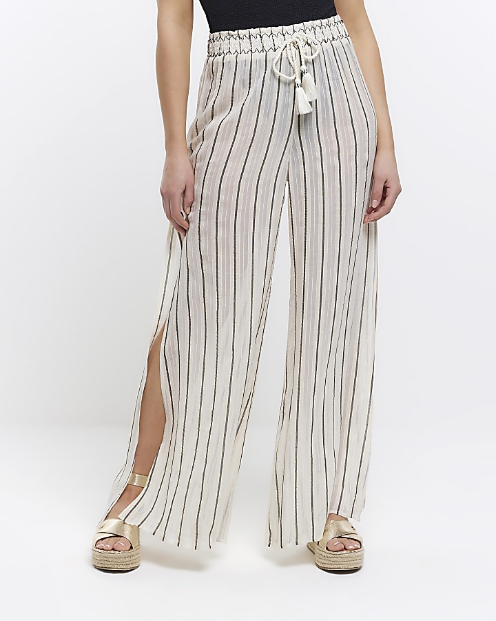Beige sheer stripe split hem trousers