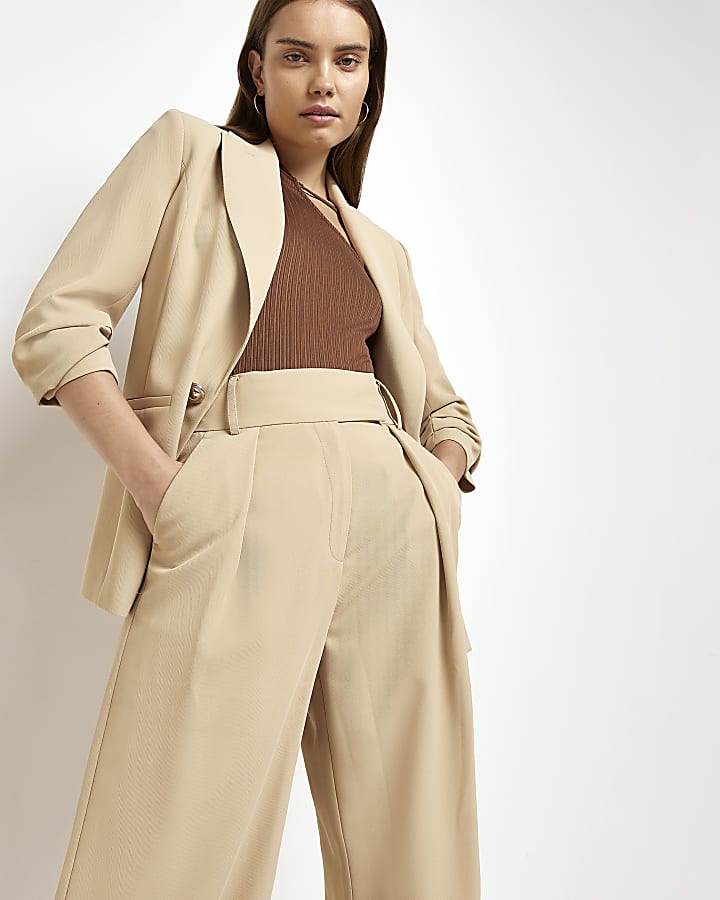 Beige pleated wide leg trousers