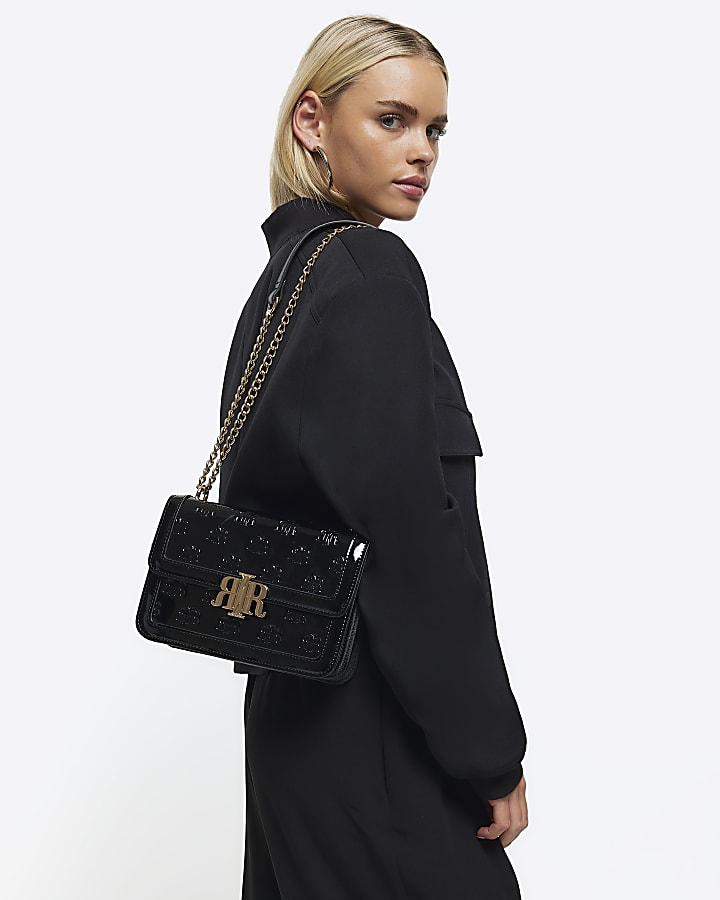 Black embossed RI lock shoulder bag