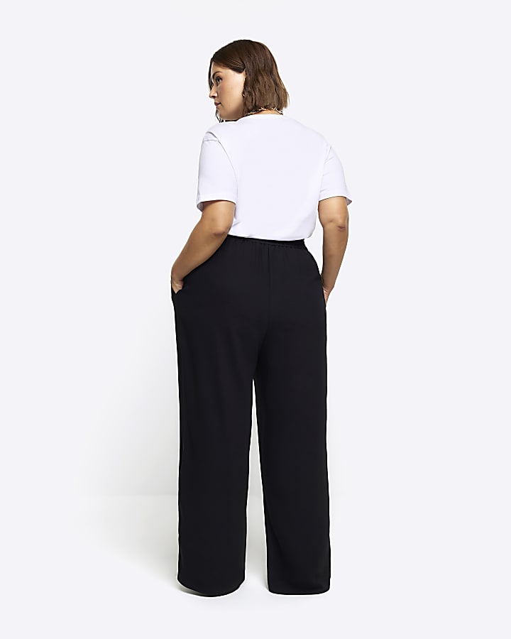 Black pleated wide leg trousers