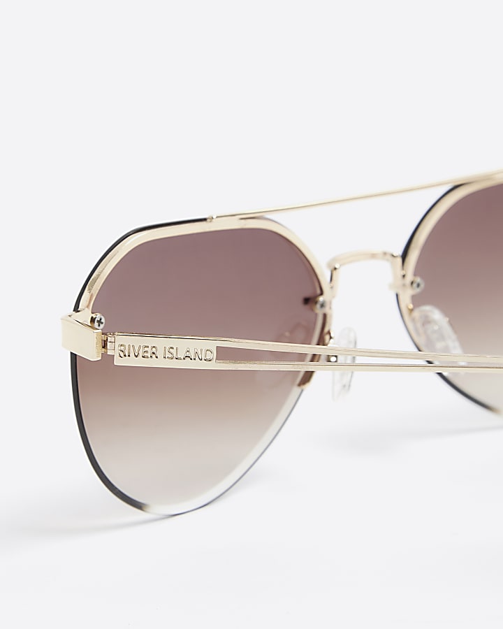 Gold rimless aviator sunglasses