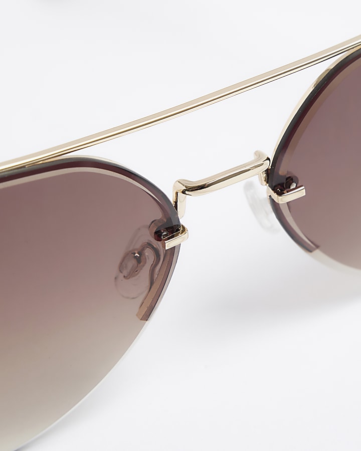 Gold rimless aviator sunglasses