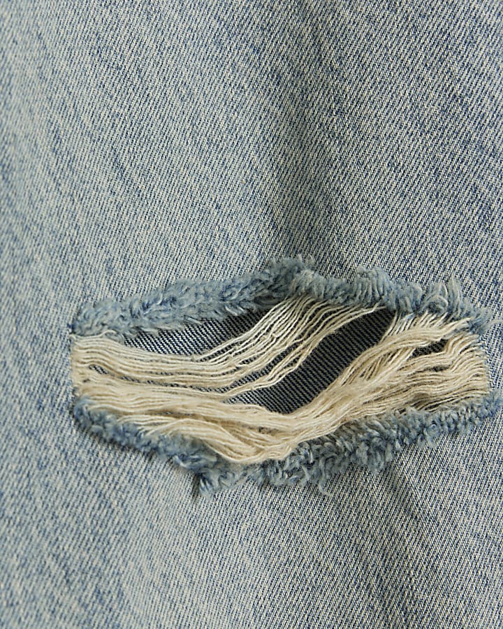 Blue stove pipe straight ripped jeans