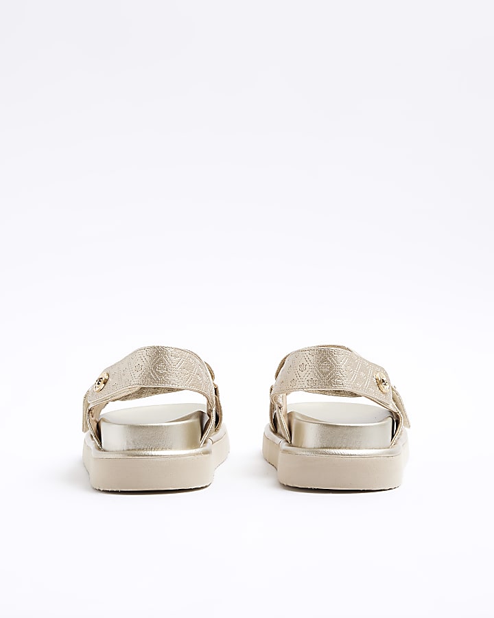 Gold embossed cross strap sandals
