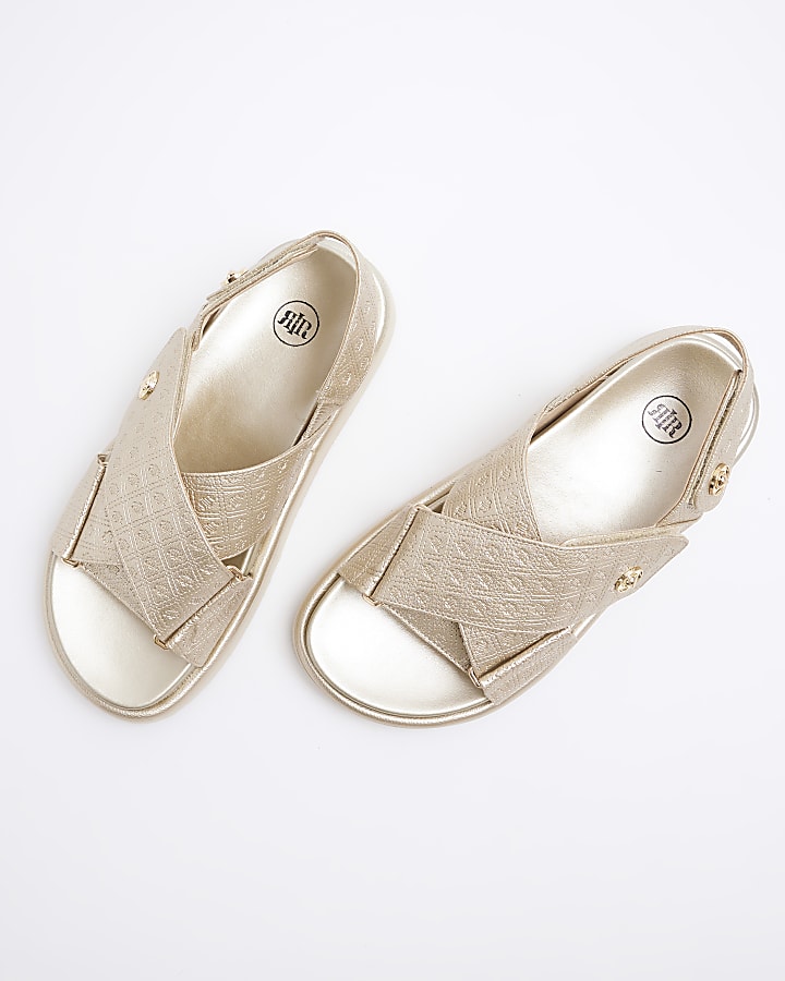 Gold embossed cross strap sandals