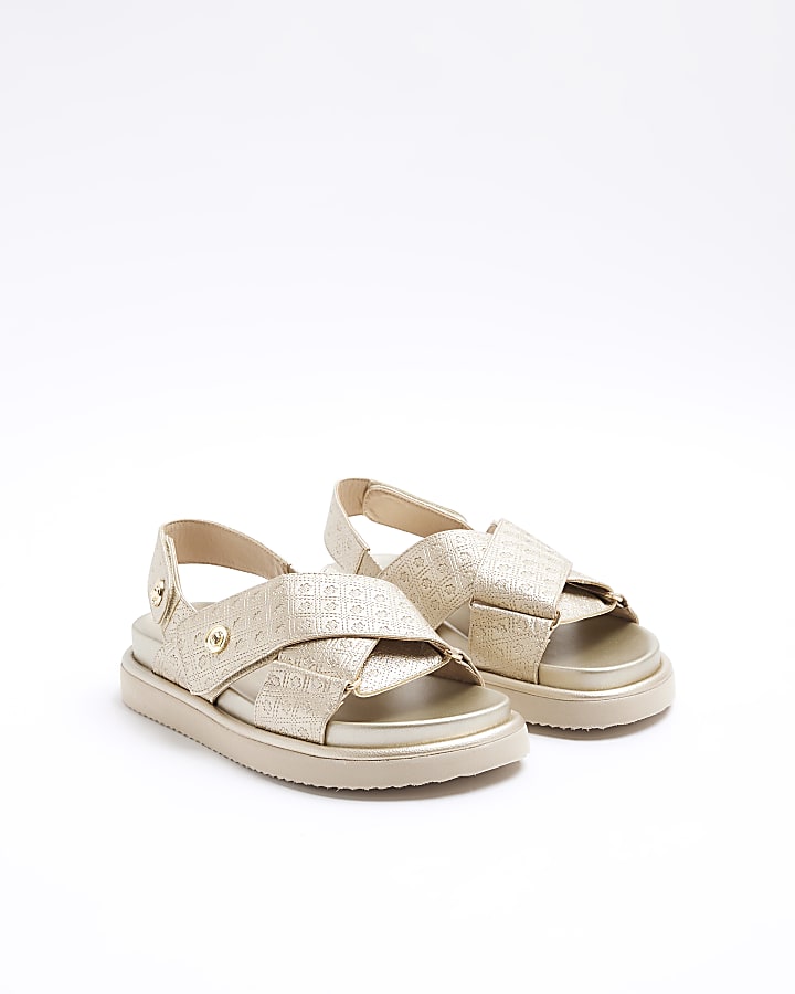 Gold embossed cross strap sandals