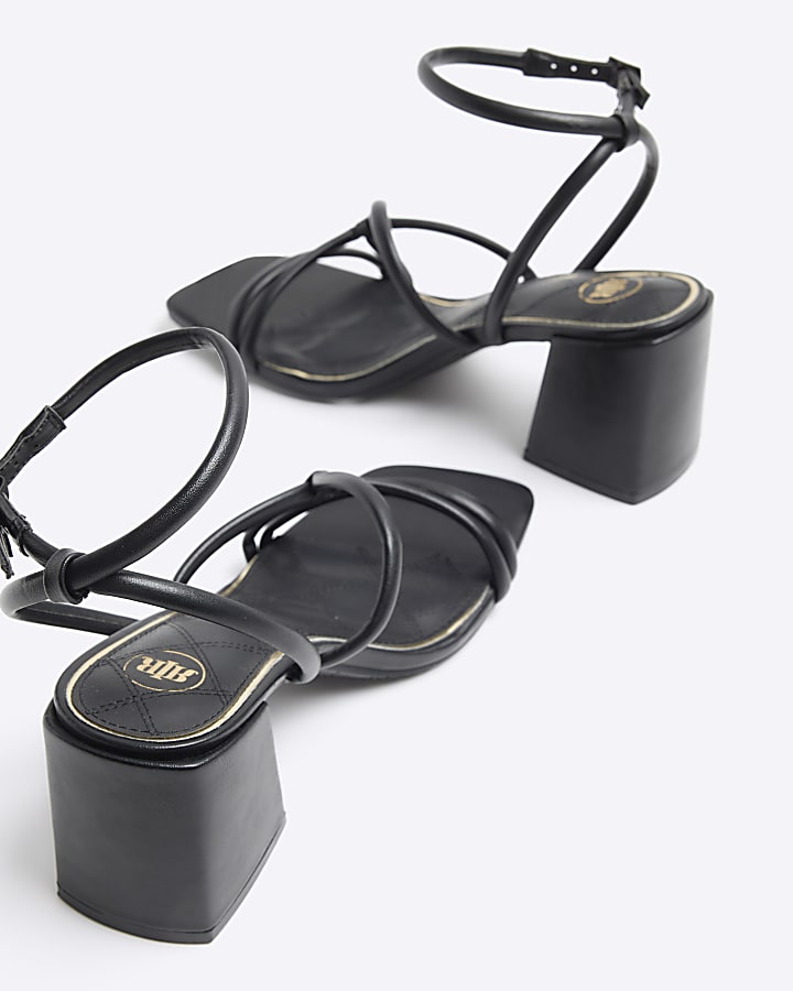 Black strappy heeled sandals