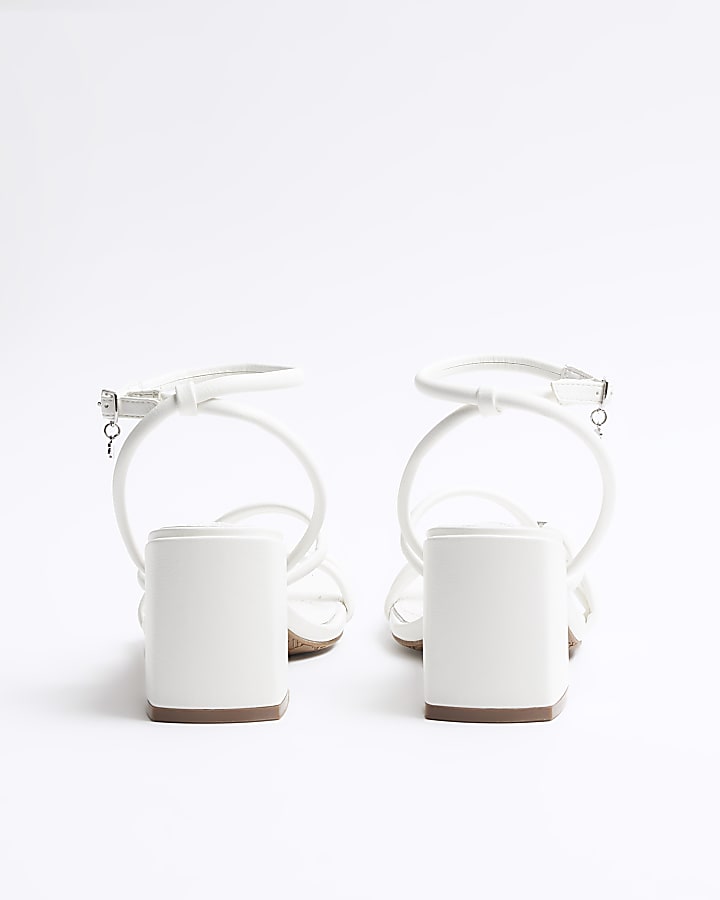 White strappy heeled sandals