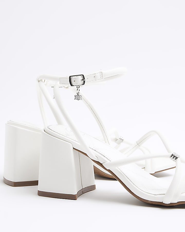 White strappy heeled sandals