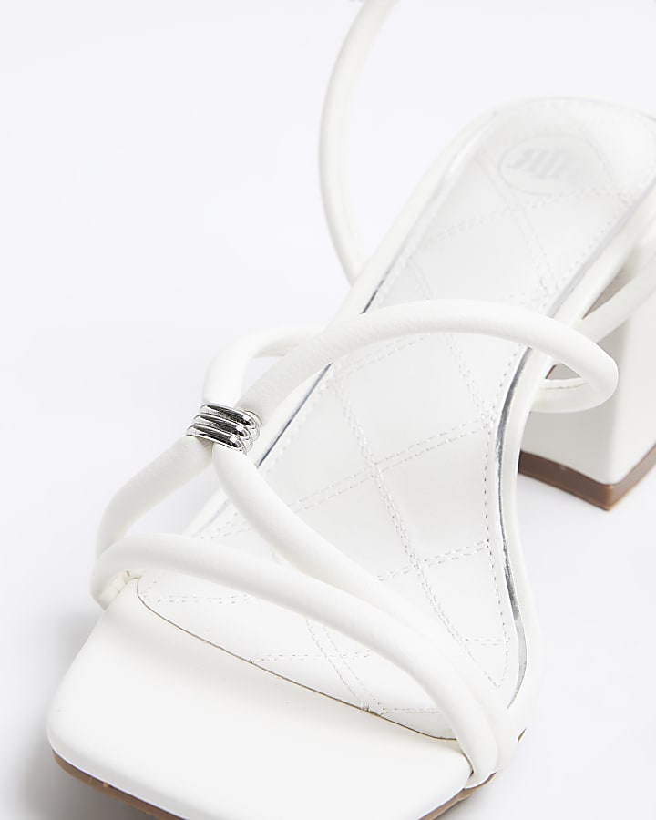 White strappy heeled sandals