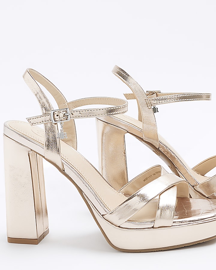 Rose gold crossed strap heeled sandals