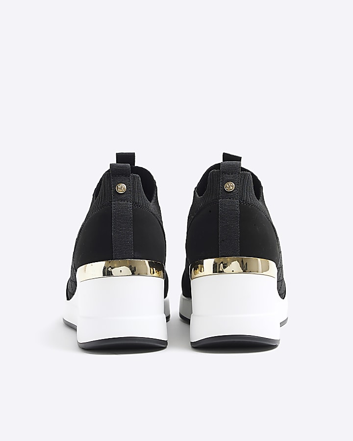 Black wide fit quilted wedge trainers