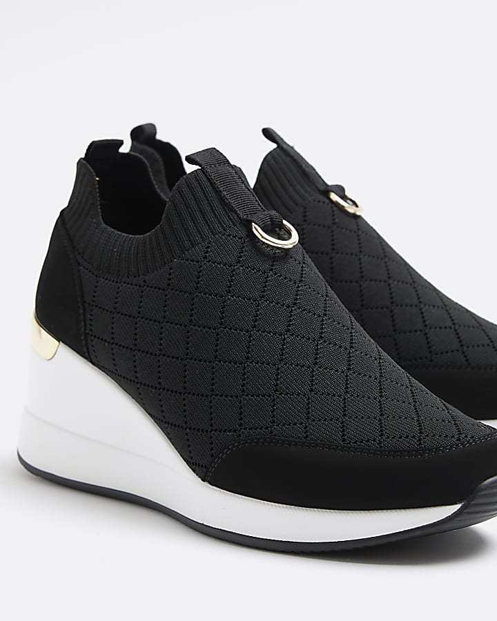Black wide fit quilted wedge trainers