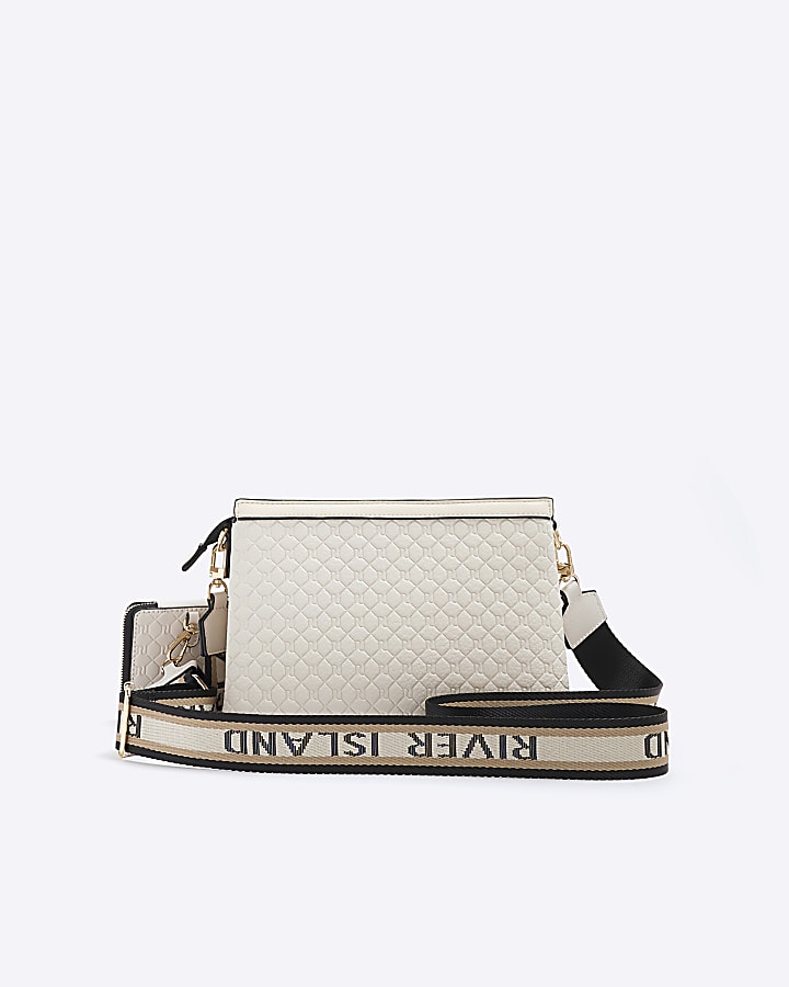 Cream embossed monogram cross body bag