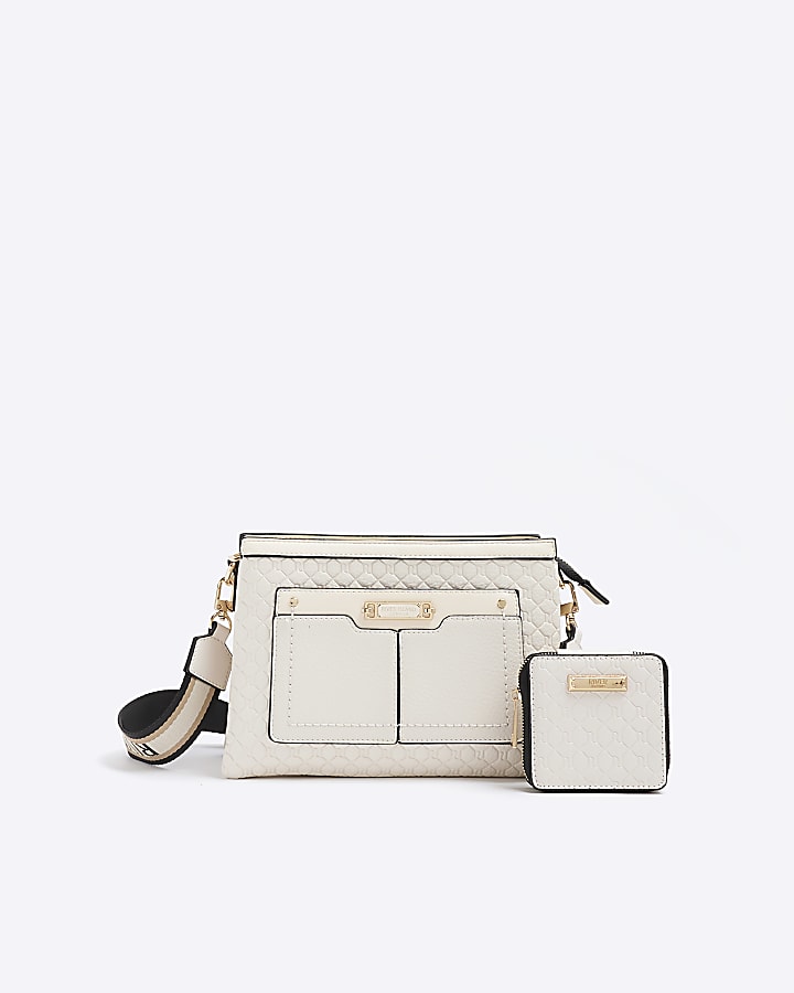 Cream embossed monogram cross body bag