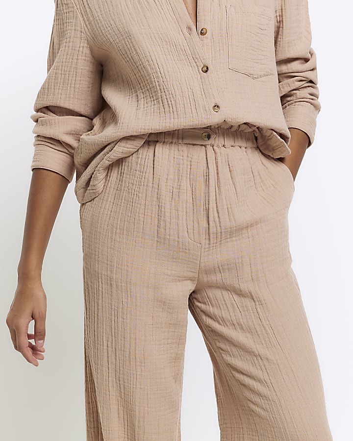 Beige textured wide leg trousers