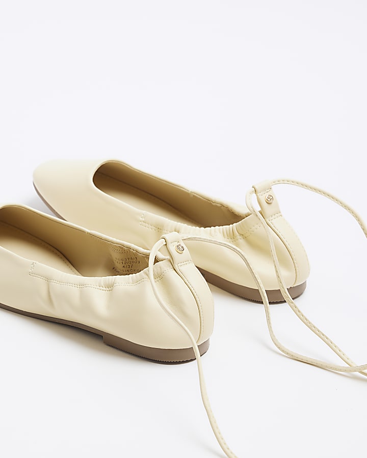 Yellow tie up ballet pumps