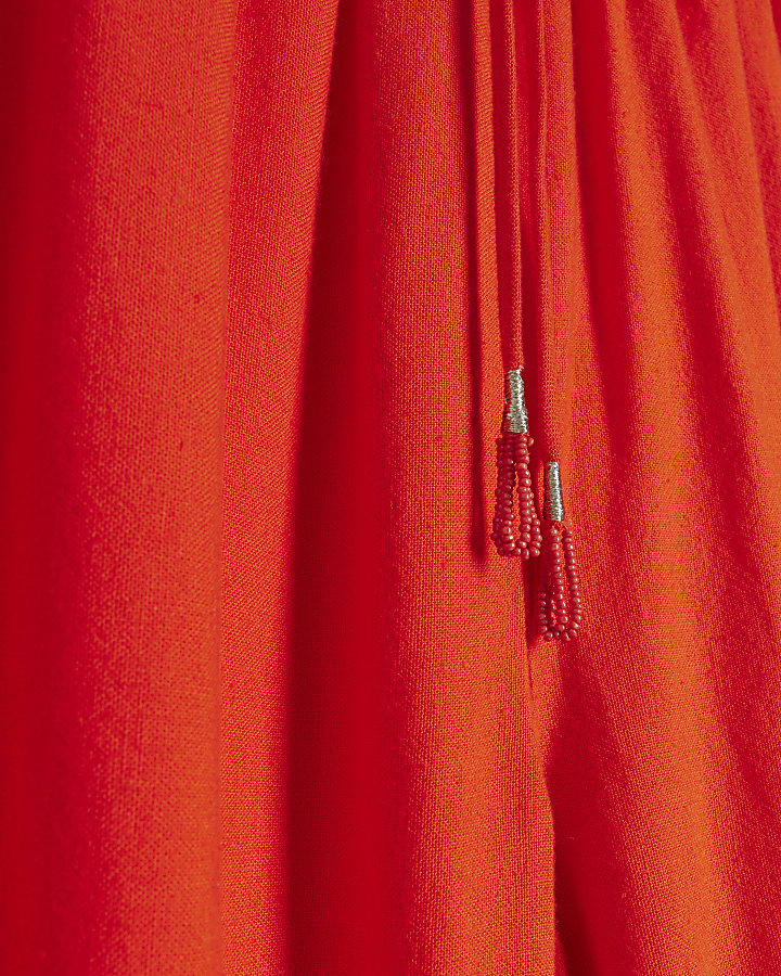 Red broderie linen blend trousers