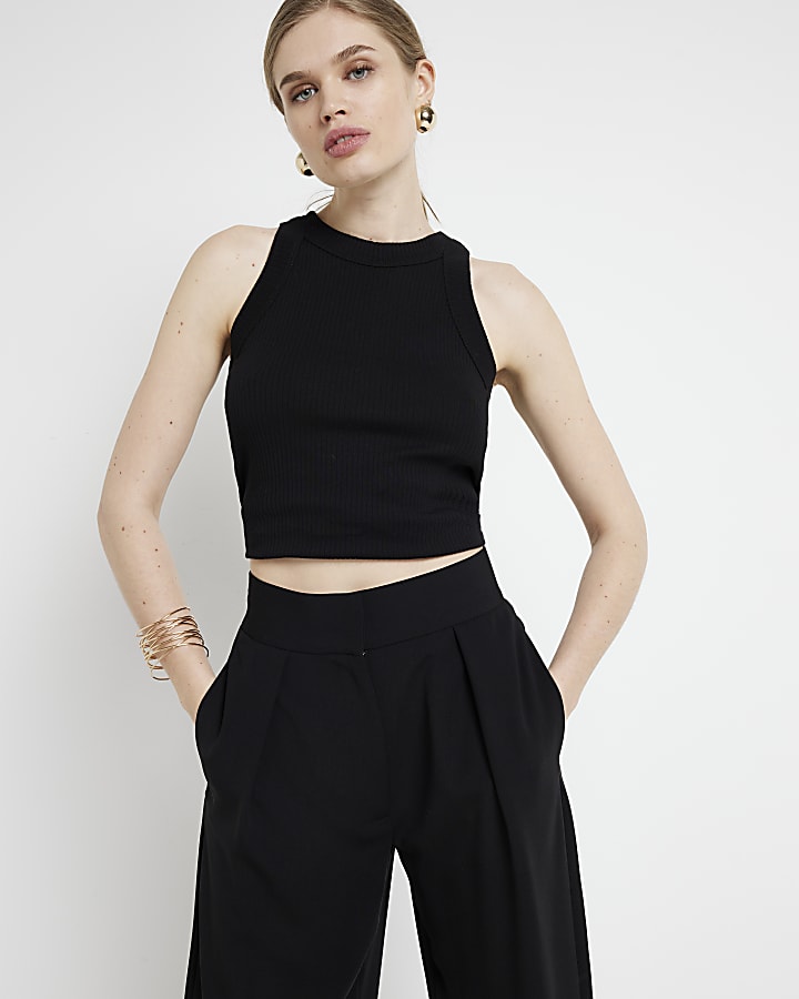 Black pleated wide leg trousers