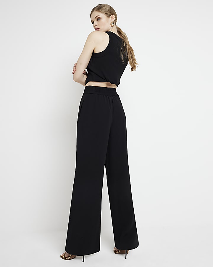 Black pleated wide leg trousers