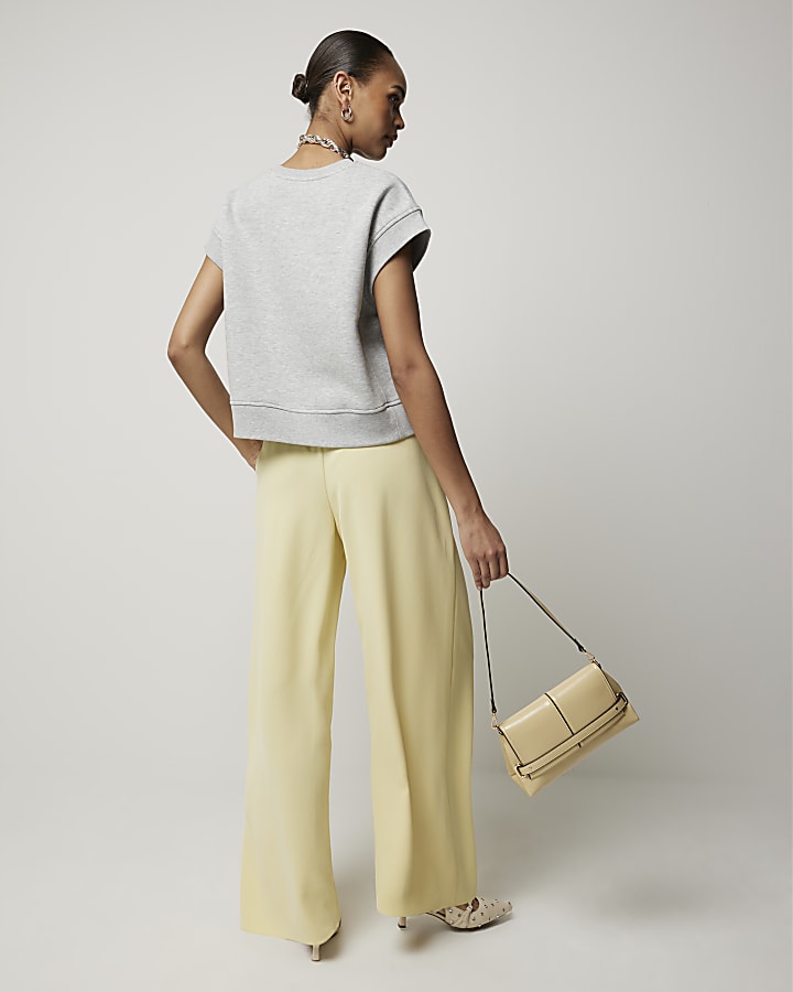 Yellow pleated wide leg trousers