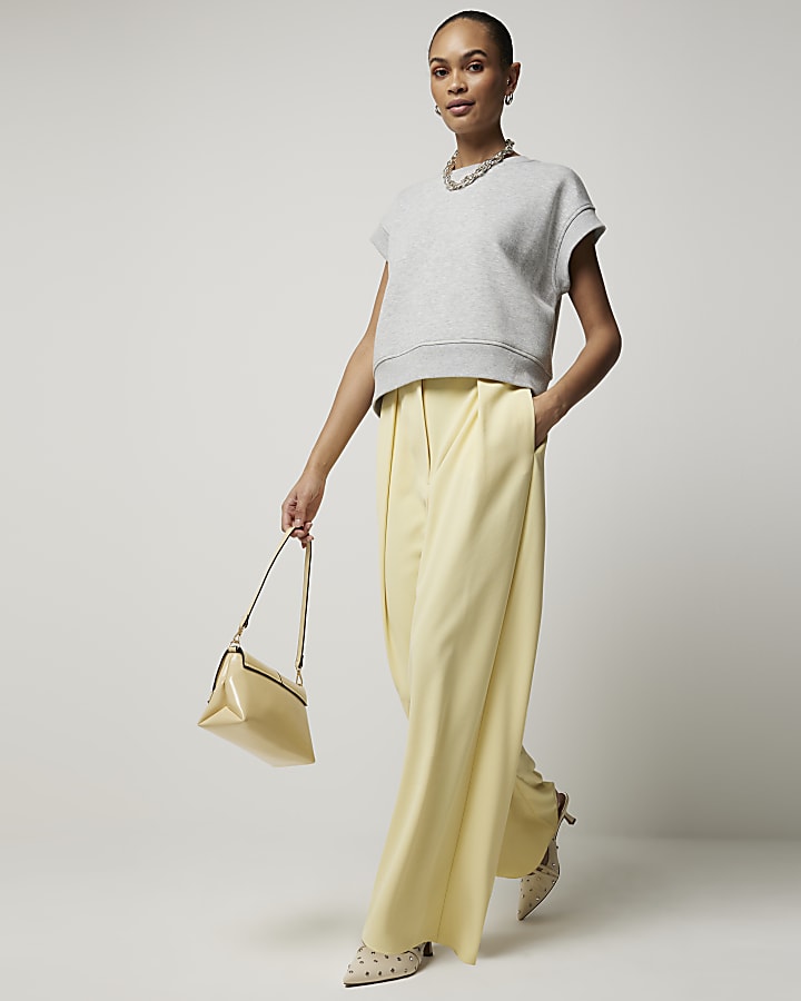 Yellow pleated wide leg trousers