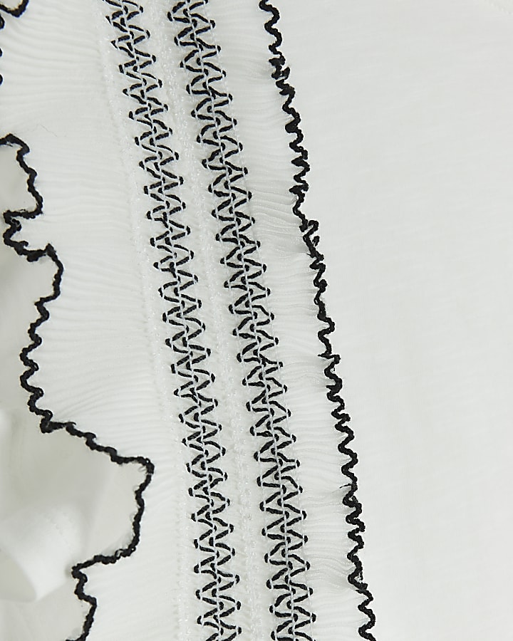 Cream frill stitched top