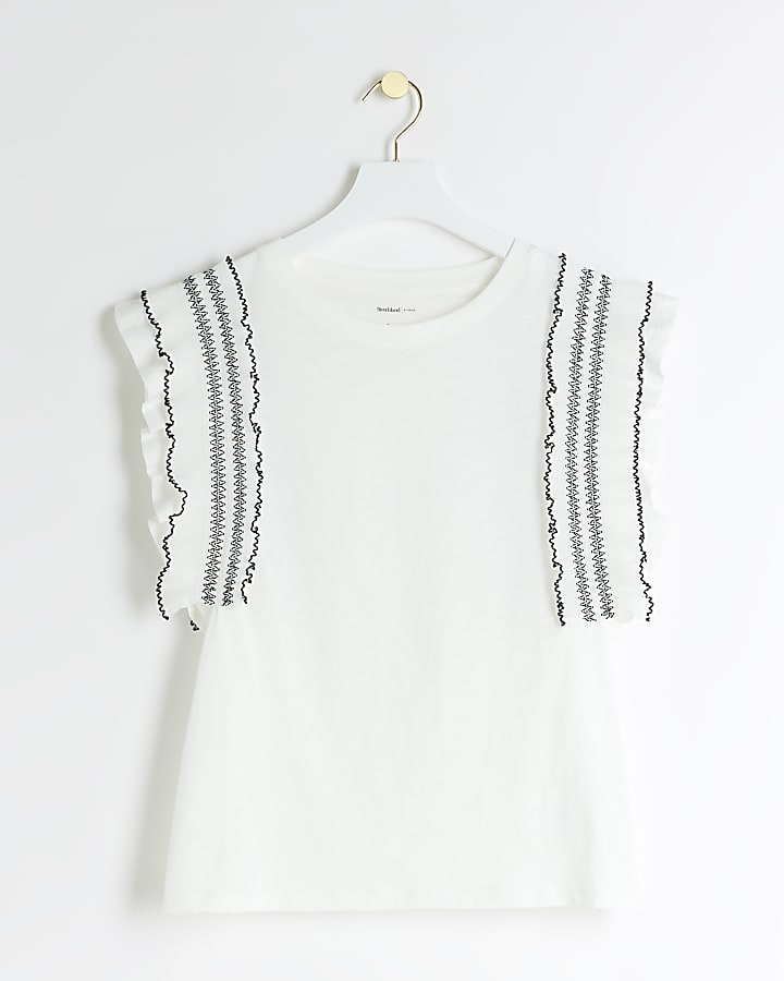 Cream frill stitched top