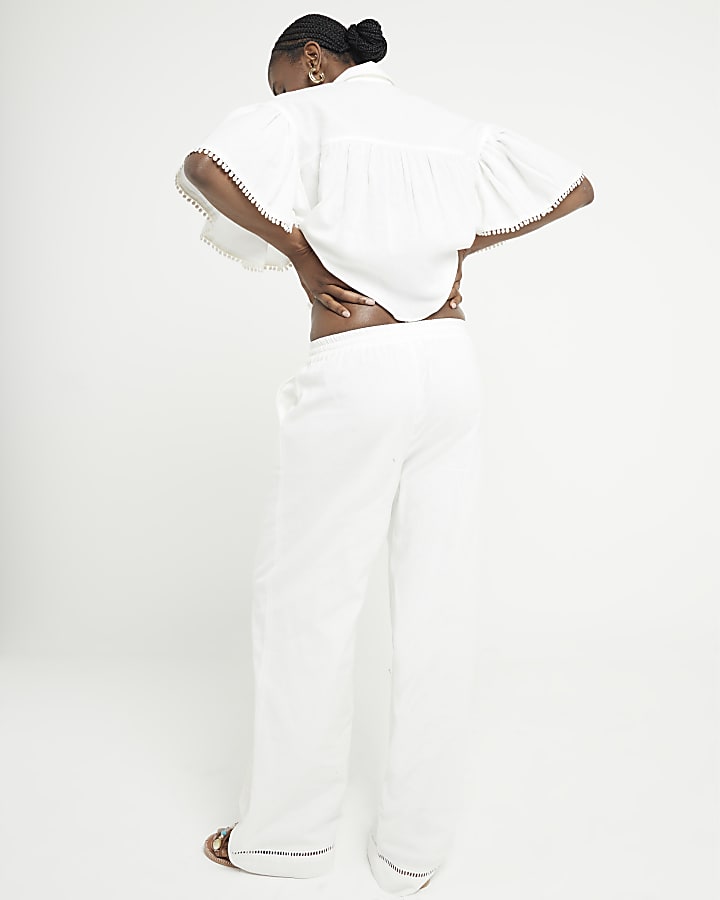 White broderie wide leg trousers