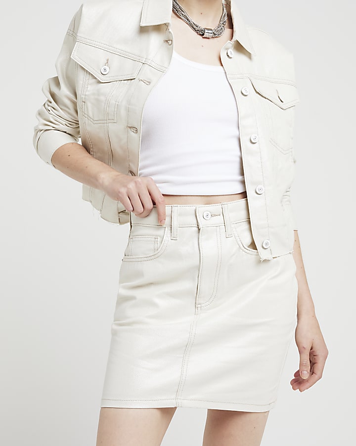 Beige metallic coated denim mini skirt