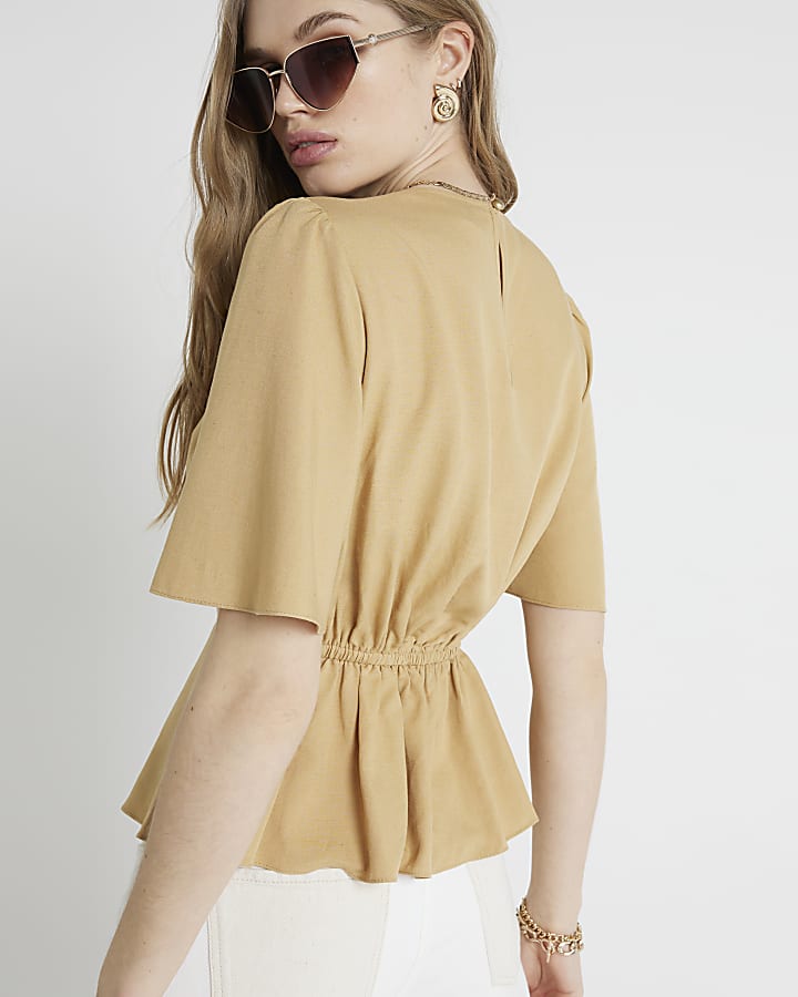 Beige beaded peplum top