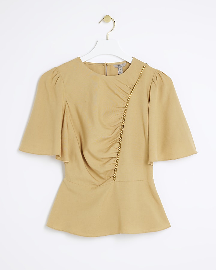 Beige beaded peplum top