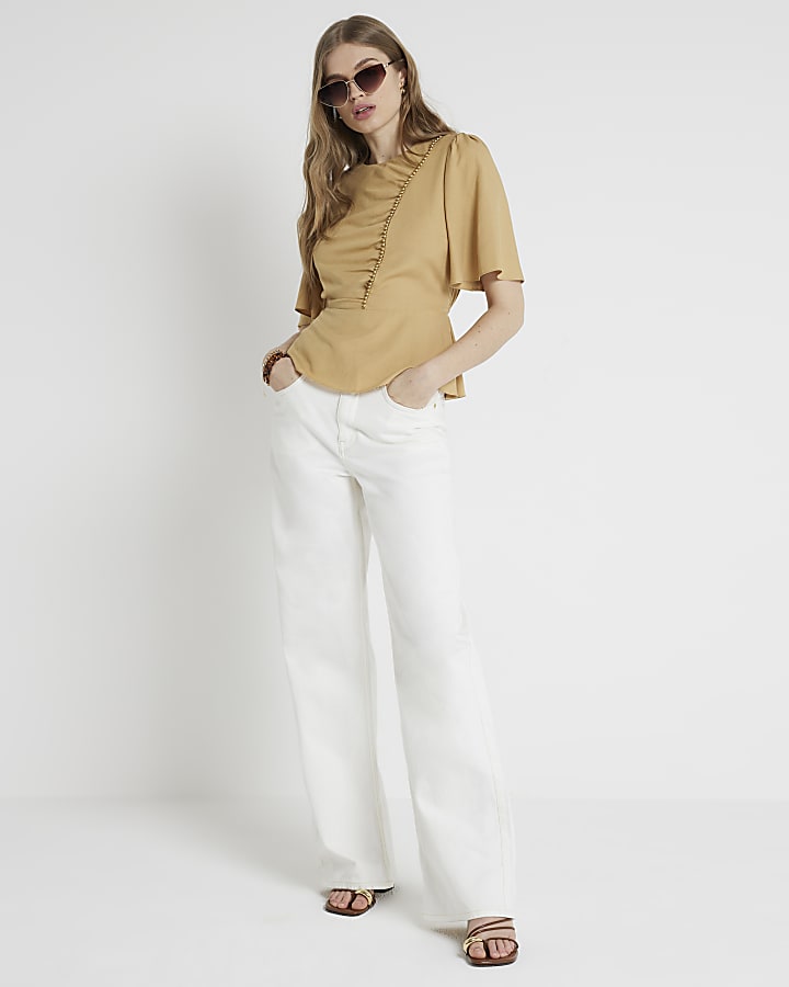 Beige beaded peplum top